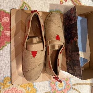 TOMS tan Slip-On Shoes with Red Accents